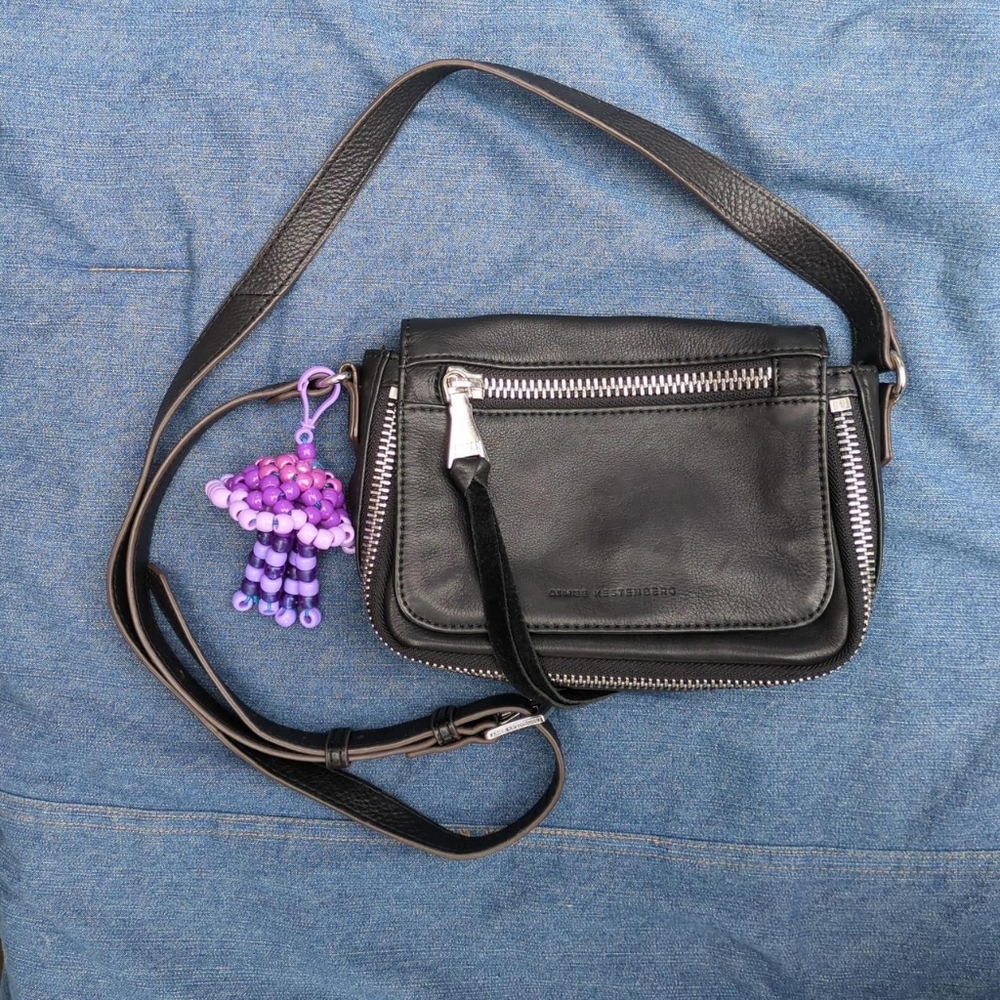 Purple hand made jelly fish beaded purse charm.